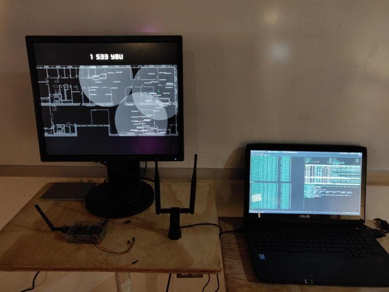 Two laptops, a raspberry pi, and an antennae showing maps and terminals